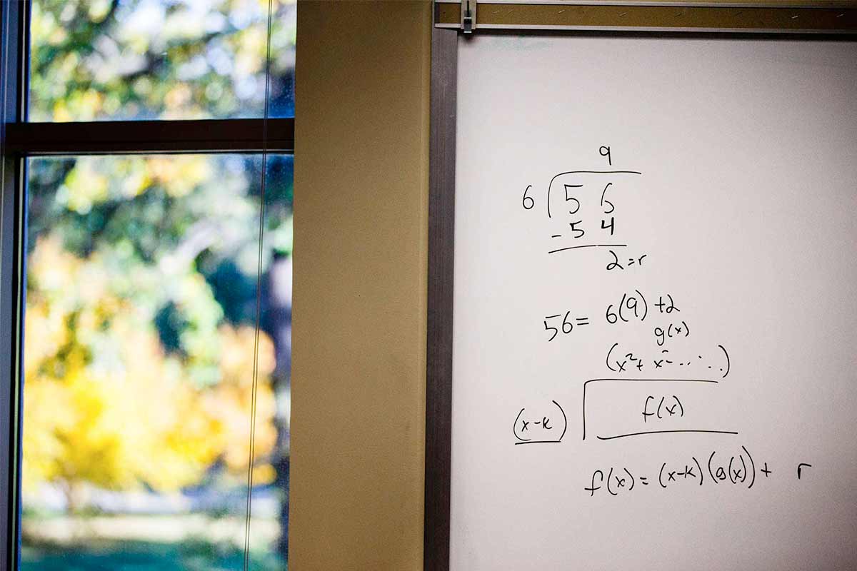 A math formula on a white board in the math resource center.